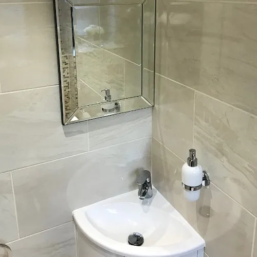 Stone Heat Ltd - Bathrooms - cloak room mirror and sink - Loughton